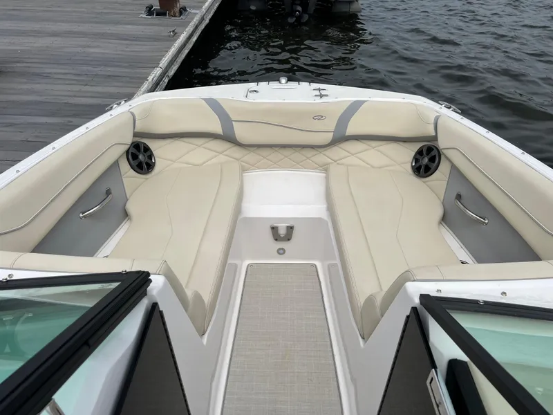 Slide: The Image of Control panel of a 2022 Regal Fasdeck boat featuring a Fusion audio system. - 11