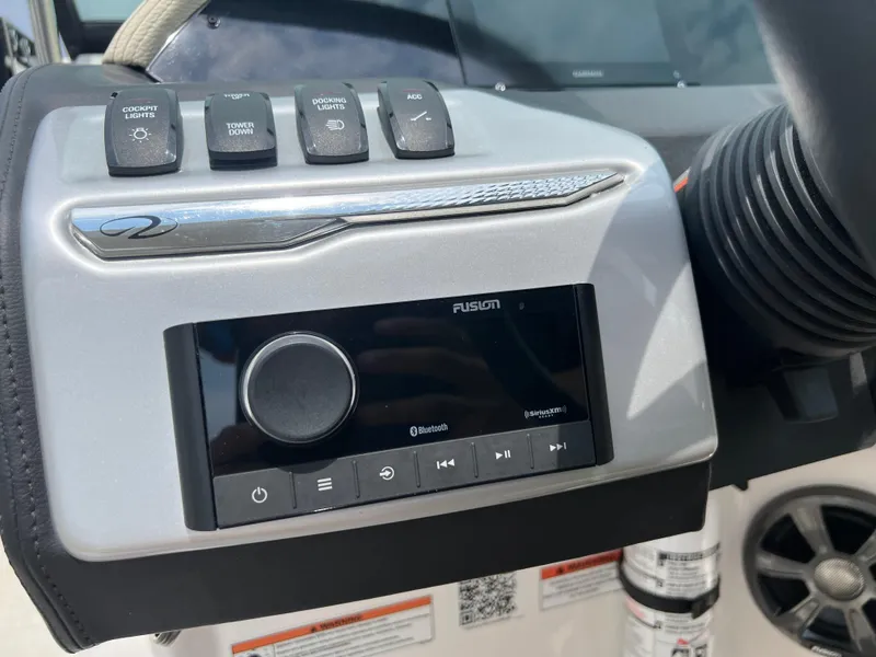 Slide: The Image of 2022 Regal FasDeck dashboard with Garmin display on a sunny day. - 12