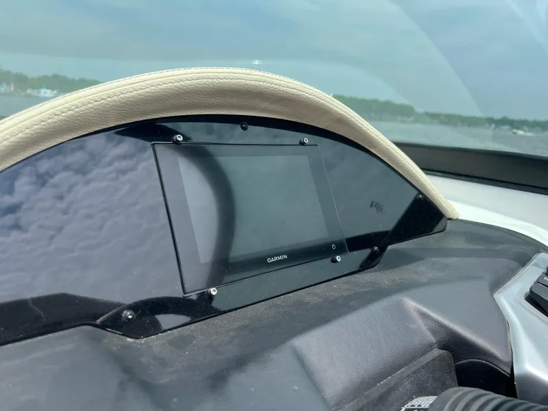 Slide: The Image of Dashboard of 2022 Regal Fasdeck boat with Garmin display showing speed and navigation data. - 13