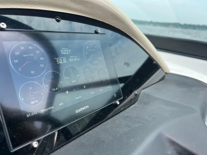 Slide: The Image of 2022 Regal FasDeck engine compartment with Volvo Penta motor, showcasing detailed components. - 14