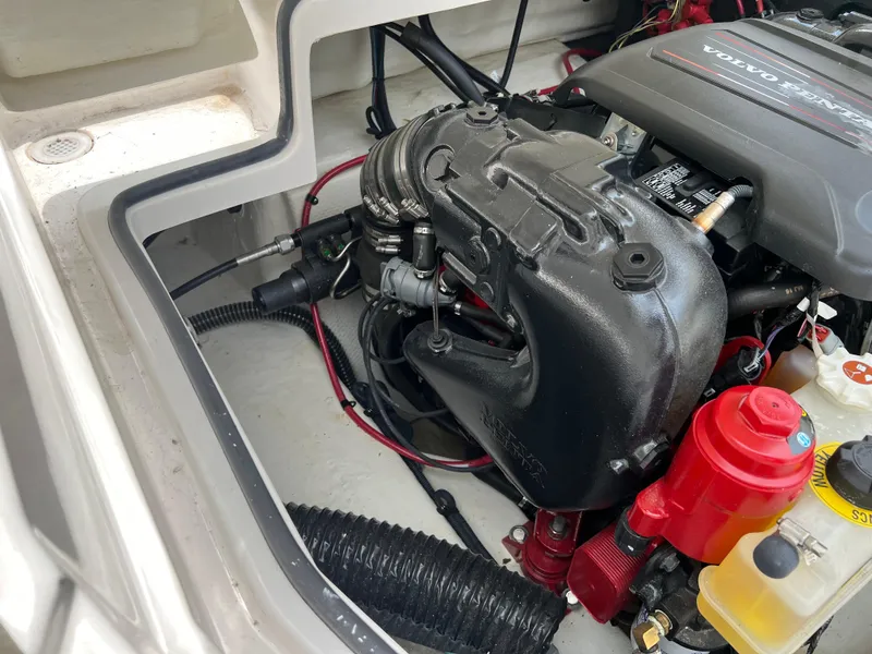 Slide: The Image of 2022 Regal Fasdeck boat engine compartment with Volvo Penta engine. - 16