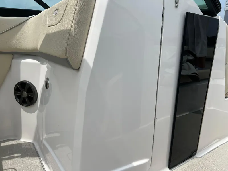 Slide: The Image of 2022 Regal FasDeck boat interior with beige seating and modern design. - 9