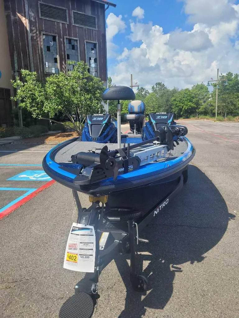 Slide: The Image of 2025 Nitro Z18 Pro boat parked outdoors, showcasing sleek design and modern features. - 3