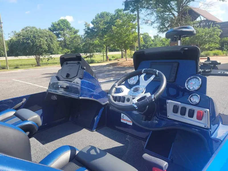 Slide: The Image of Interior of a 2025 Nitro Z18 Pro boat with steering wheel and dashboard controls. - 5