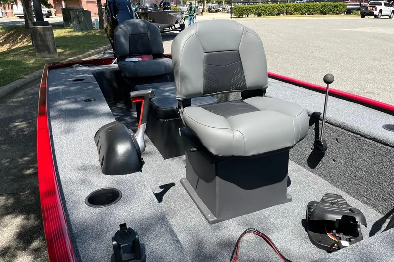 Slide: The Image of 2025 Tracker Panfish 17 boat interior with gray seating and red trim. - 7