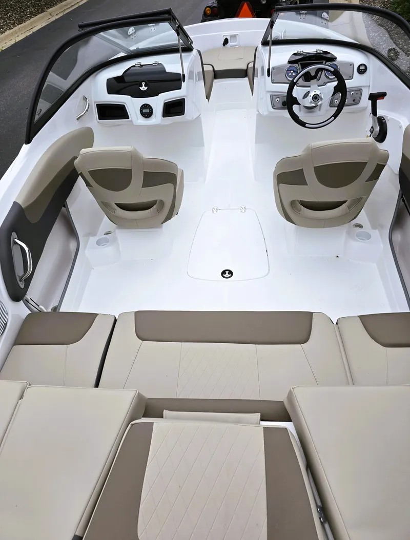 Slide: The Image of 2025 Tahoe 200 S boat interior with beige seating and modern dashboard design. - 3