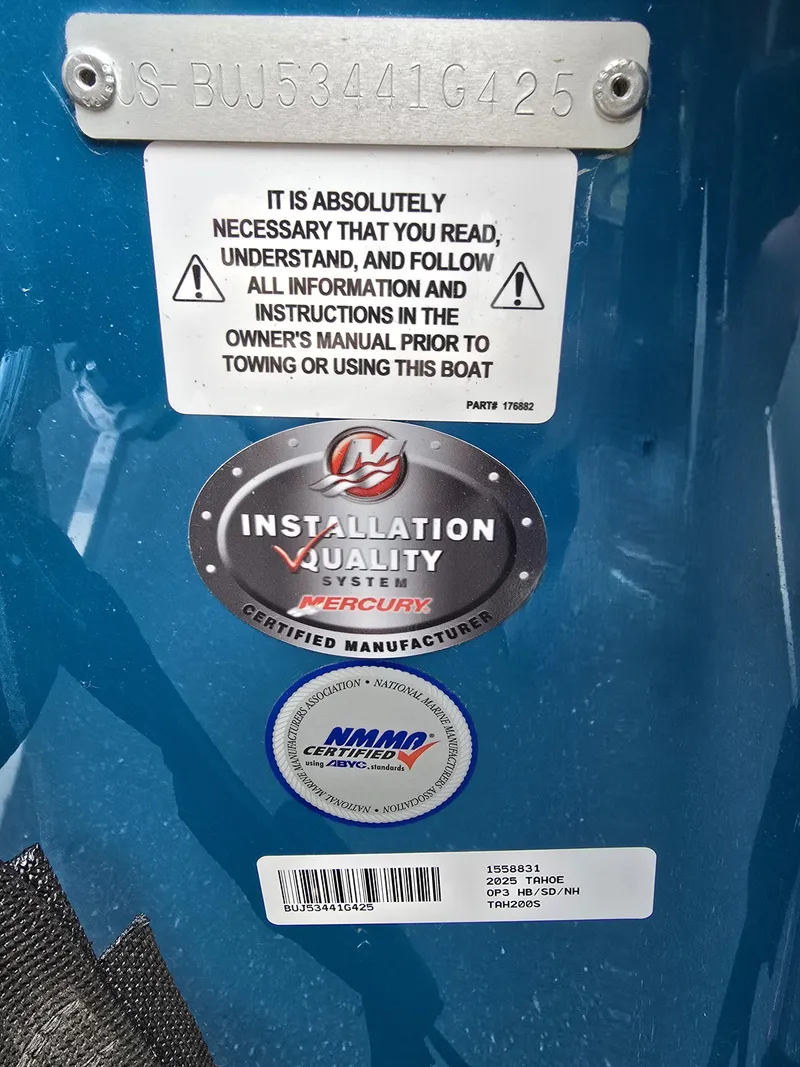 Slide: The Image of 2025 Tahoe 200 S boat warning and certification labels, including Mercury installation quality badge. - 6