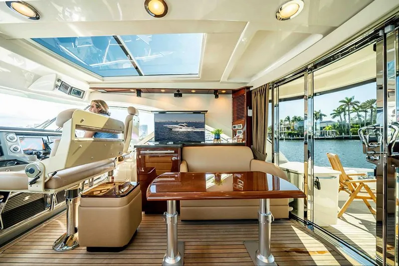 Slide: The Image of Luxurious interior of 2012 Sea Ray 610 Sundancer yacht with elegant seating and scenic views. - 17