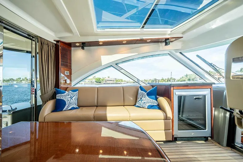 Slide: The Image of Luxurious interior of 2012 Sea Ray 610 Sundancer yacht with leather seating and scenic views. - 18