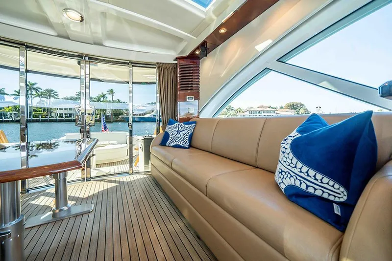 Slide: The Image of Luxurious interior of 2012 Sea Ray 610 Sundancer yacht with elegant seating and scenic views. - 19