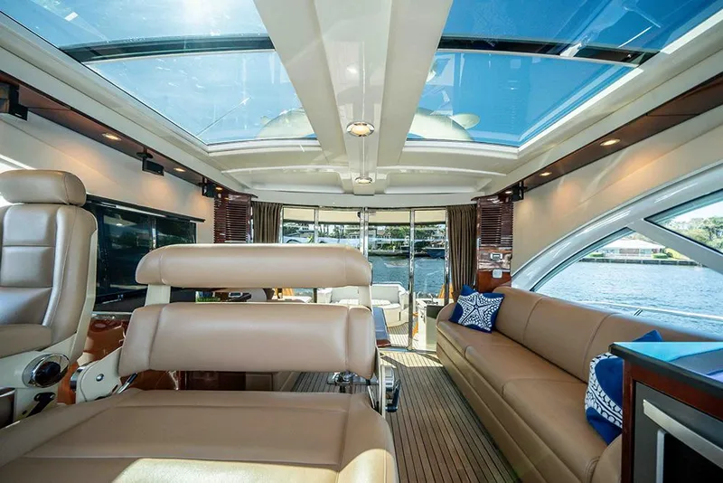 Slide: The Image of Luxurious interior of 2012 Sea Ray 610 Sundancer yacht with panoramic windows and plush seating. - 20