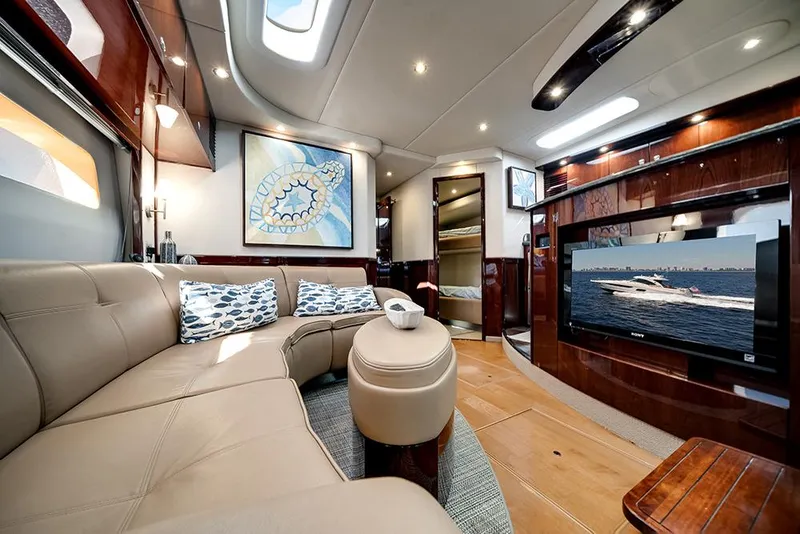 Slide: The Image of Luxurious interior of 2012 Sea Ray 610 Sundancer yacht with plush seating and modern amenities. - 27
