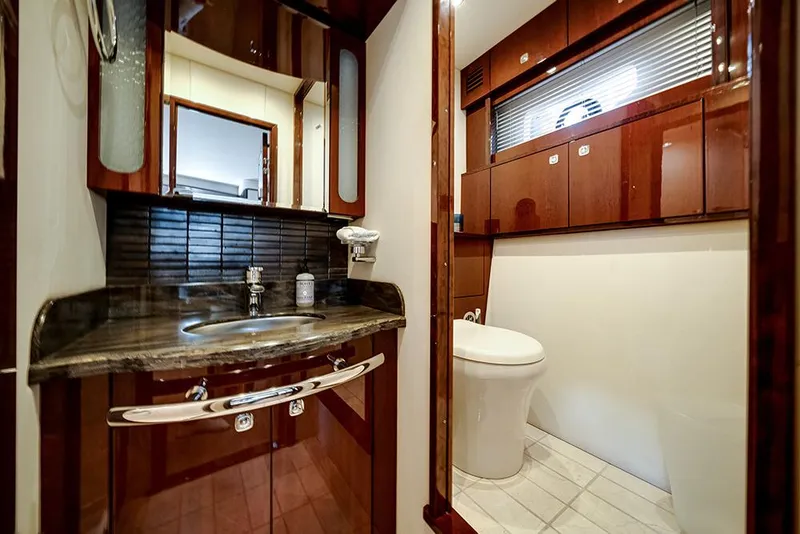 Slide: The Image of Luxurious bathroom interior of 2012 Sea Ray 610 Sundancer yacht with elegant wood finishes. - 36