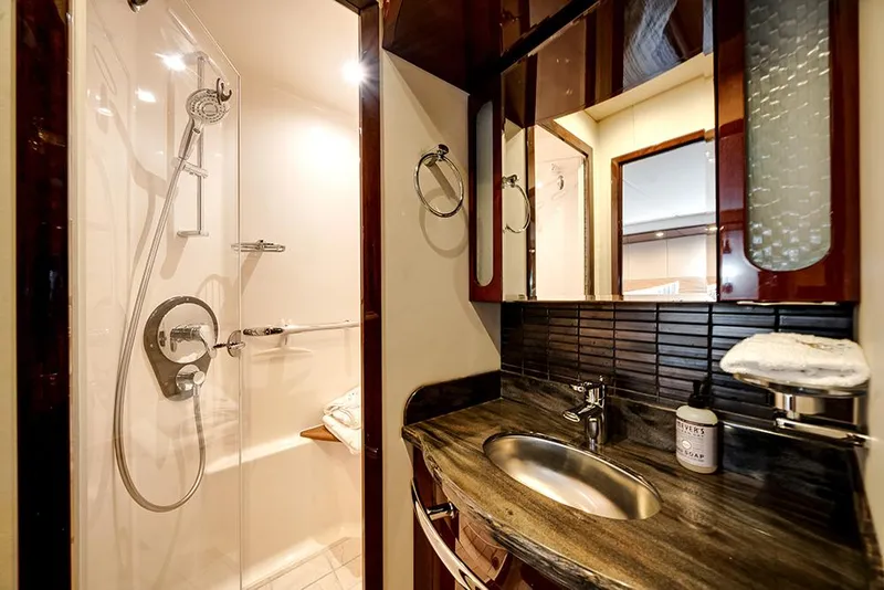 Slide: The Image of Luxurious bathroom in 2012 Sea Ray 610 Sundancer yacht with modern fixtures and elegant design. - 37