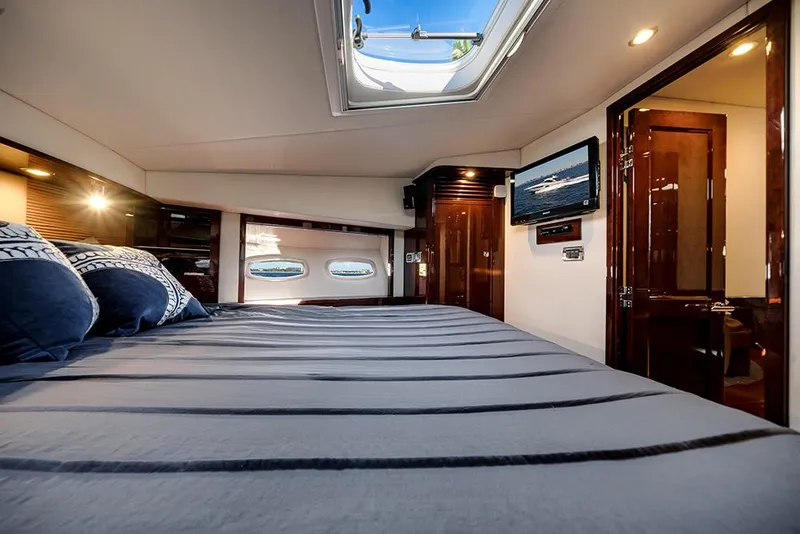 Slide: The Image of Luxurious cabin interior of 2012 Sea Ray 610 Sundancer yacht with skylight and modern amenities. - 40