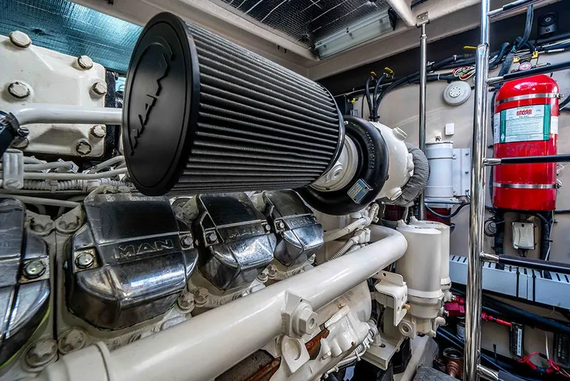 Slide: The Image of Engine room of 2012 Sea Ray 610 Sundancer with MAN engine and fire extinguisher. - 47