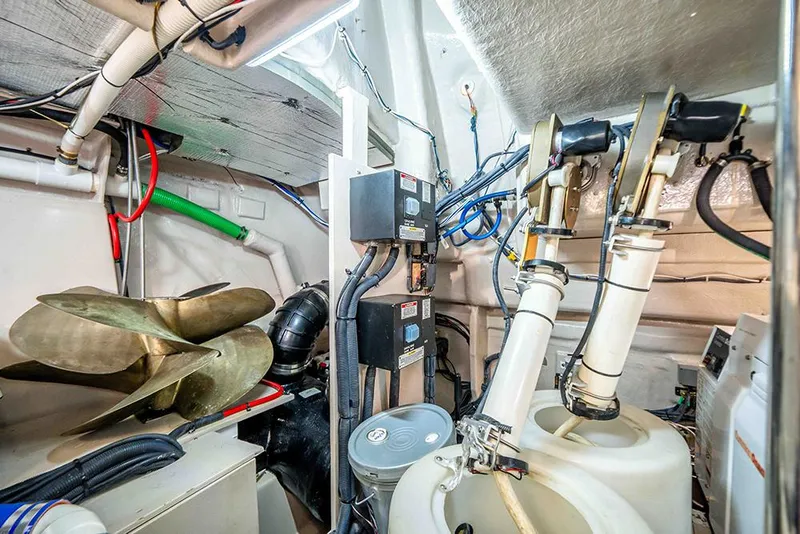 Slide: The Image of Engine room of 2012 Sea Ray 610 Sundancer with mechanical components. - 49