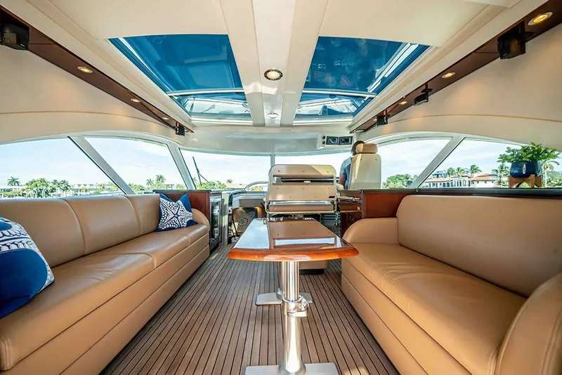 Slide: The Image of Luxurious interior of 2012 Sea Ray 610 Sundancer yacht with leather seating and panoramic windows. - 5