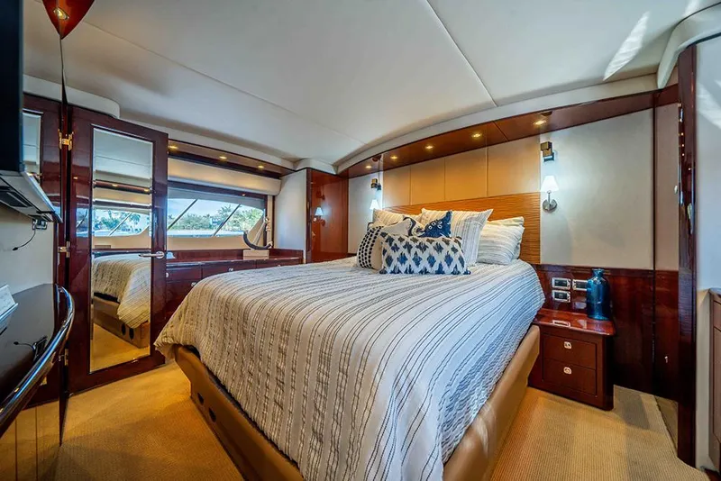 Slide: The Image of Luxurious bedroom interior of 2012 Sea Ray 610 Sundancer yacht with elegant decor. - 7