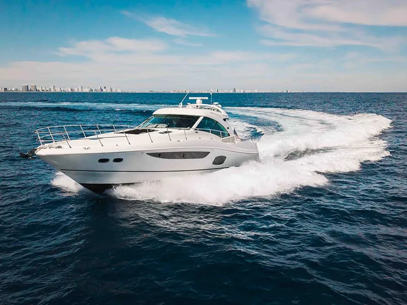 Slide: The Image of Luxurious 2012 Sea Ray 610 Sundancer yacht cruising on open ocean waters. - 8