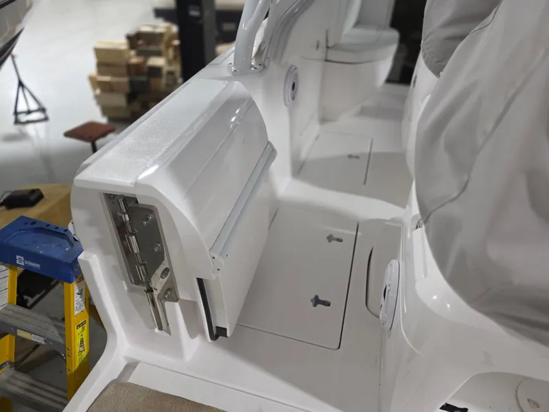 Slide: The Image of 2021 Intrepid 345 Valor boat interior with seating and storage compartments. - 15