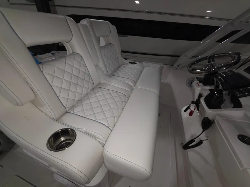 Slide: The Image of Luxurious white seating in 2021 Intrepid 345 Valor boat cockpit. - 19