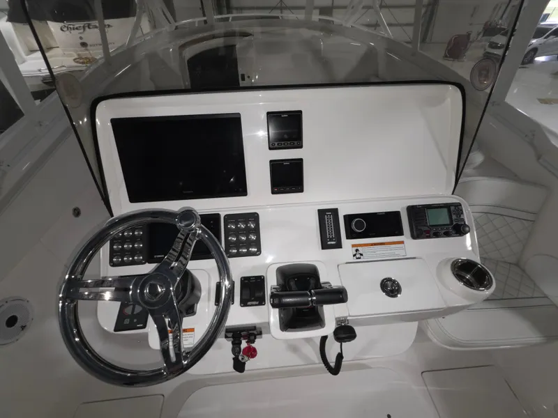 Slide: The Image of 2021 Intrepid 345 Valor helm with modern controls and navigation displays. - 20