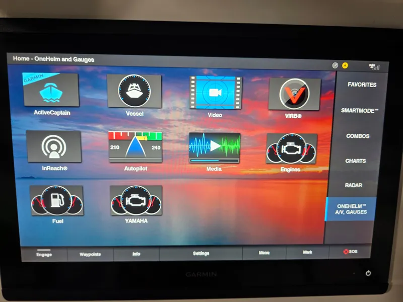 Slide: The Image of Garmin OneHelm display on 2021 Intrepid 345 Valor, showing navigation and engine controls. - 21