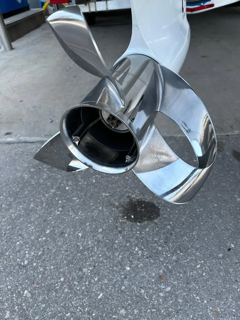 Slide: The Image of Stainless steel boat propeller of a 2021 Intrepid 345 Valor on concrete surface. - 44