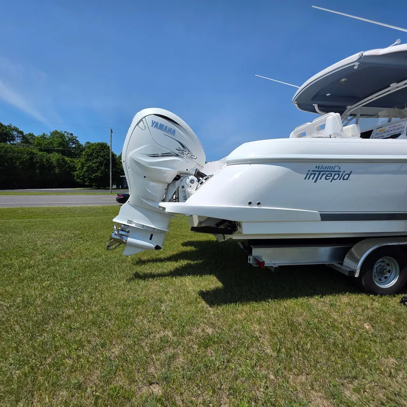 Slide: The Image of 2021 Intrepid 345 Valor boat with Yamaha engine on trailer, parked on grass. - 47