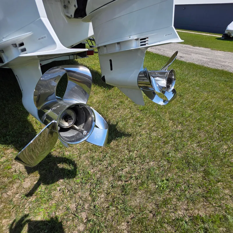 Slide: The Image of Twin propellers of a 2021 Intrepid 345 Valor boat on grass. - 48