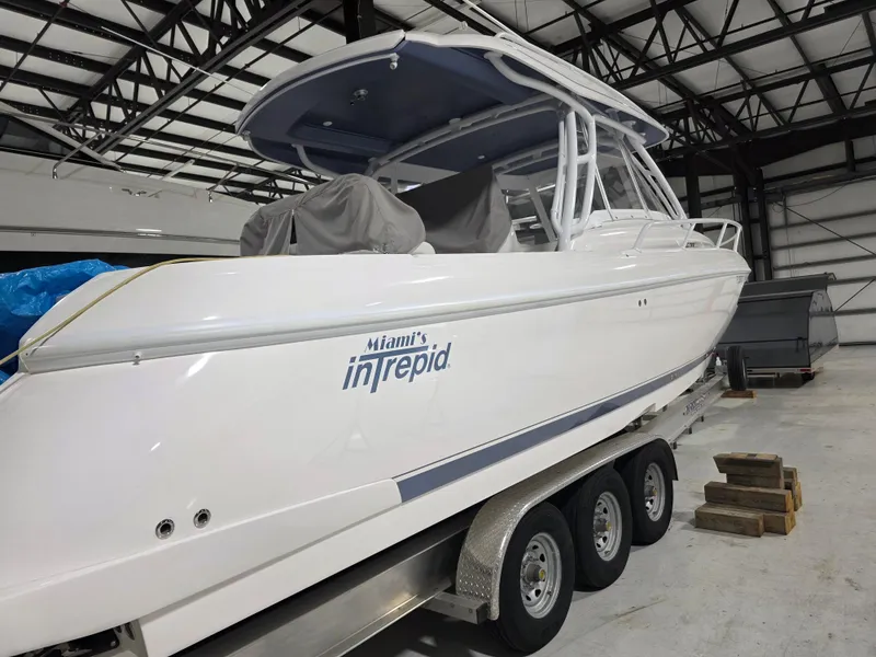 Slide: The Image of 2021 Intrepid 345 Valor boat on trailer in indoor storage facility. - 5