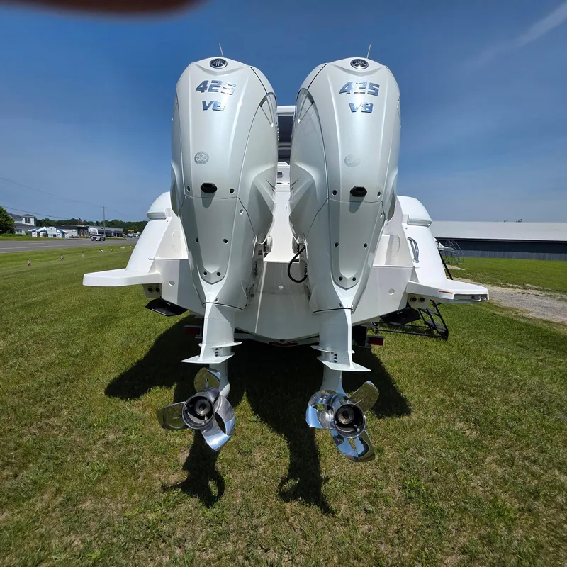Slide: The Image of 2021 Intrepid 345 Valor boat with twin 425 V8 outboard engines on grass. - 51