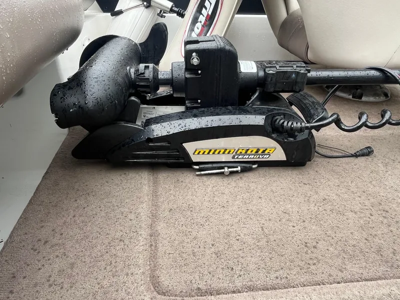 Slide: The Image of Triton SF-211 boat with Minn Kota Terrova trolling motor on carpeted deck, 2007 model. - 9