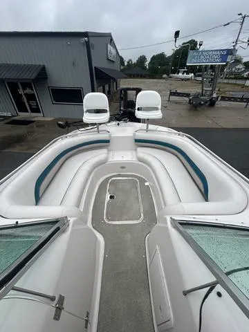 Slide: The Image of 2001 Hurricane 237 Sun Deck boat with spacious seating and dual captain chairs. - 3