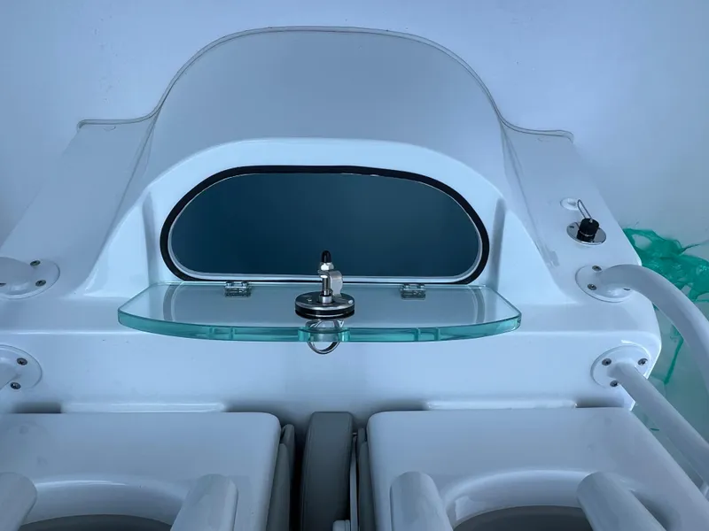 Slide: The Image of 2026 Cape Horn 24XS boat console with glass shelf and control panel. - 10