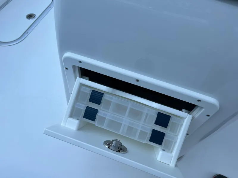 Slide: The Image of Storage compartment on a 2026 Cape Horn 24XS boat, featuring organized interior space. - 14