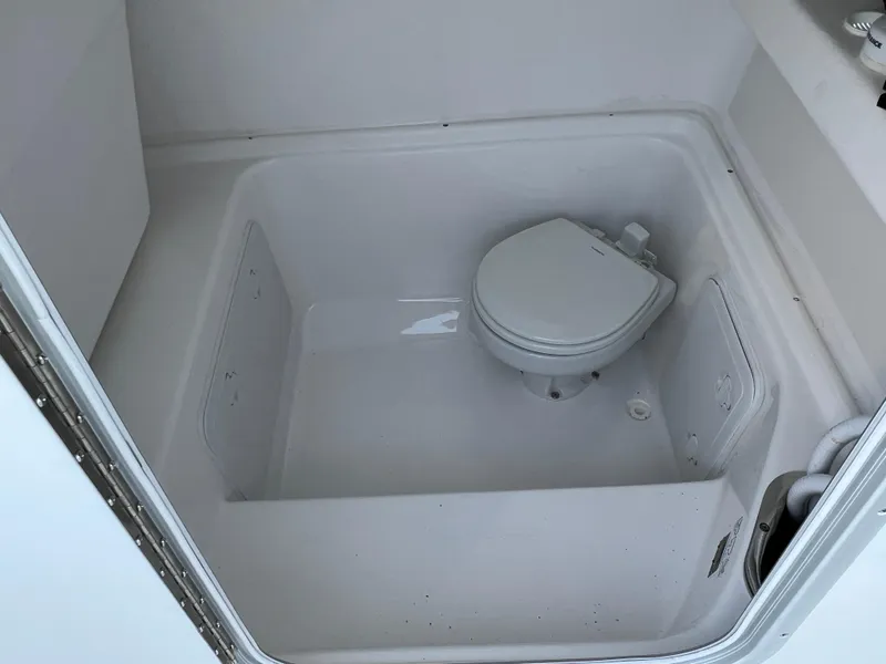 Slide: The Image of 2026 Cape Horn 24XS boat interior with compact marine toilet. - 8
