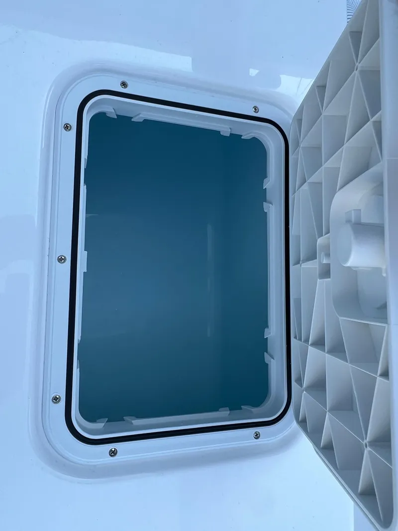 Slide: The Image of Open storage compartment on 2026 Cape Horn 24XS boat. - 9