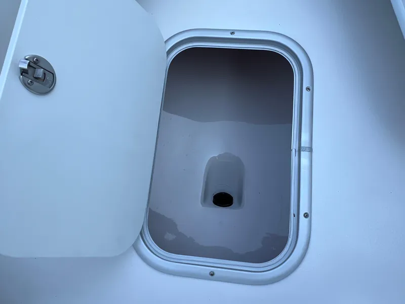 Slide: The Image of Open storage compartment on 2026 Cape Horn 24XS boat. - 11