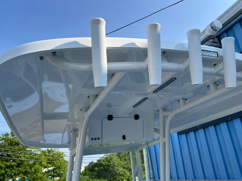 Slide: The Image of 2026 Cape Horn 24XS boat T-top with rod holders and sleek design. - 16