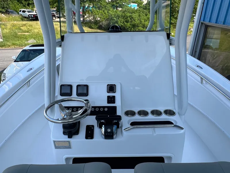 Slide: The Image of 2026 Cape Horn 24XS boat console with steering wheel and control panel. - 3