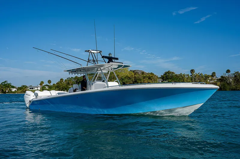 The Image of 2013 Bahama Quad V10's boat on clear blue water under a sunny sky. - 1