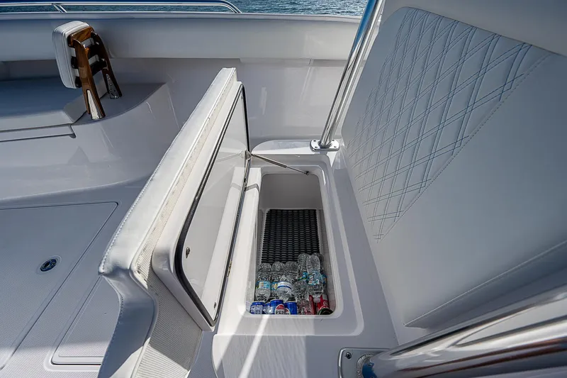 Slide: The Image of 2013 Bahama Quad V10's boat with open storage compartment containing drinks. - 10
