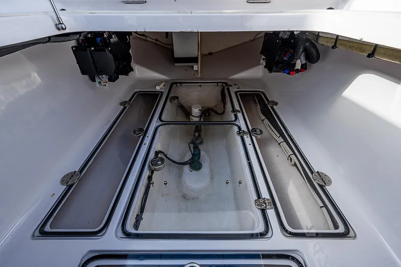 Slide: The Image of 2013 Bahama Quad V10's boat interior with storage compartments and equipment. - 15