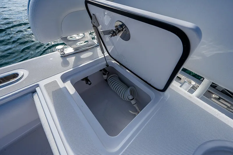 Slide: The Image of Open storage compartment on 2013 Bahama Quad V10's boat deck. - 16