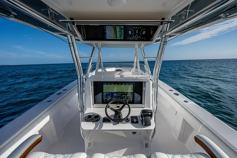 Slide: The Image of Center console of 2013 Bahama Quad V10's boat on open sea. - 17