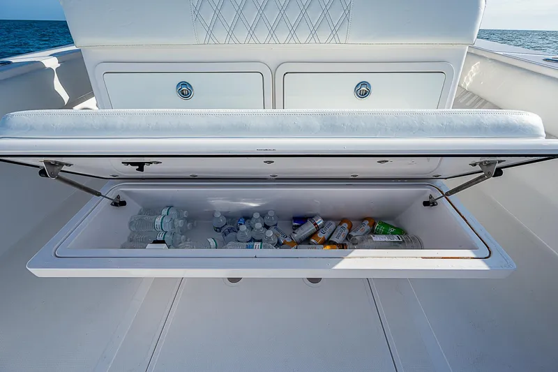 Slide: The Image of Open cooler on 2013 Bahama Quad V10's boat, filled with drinks and water bottles. - 21
