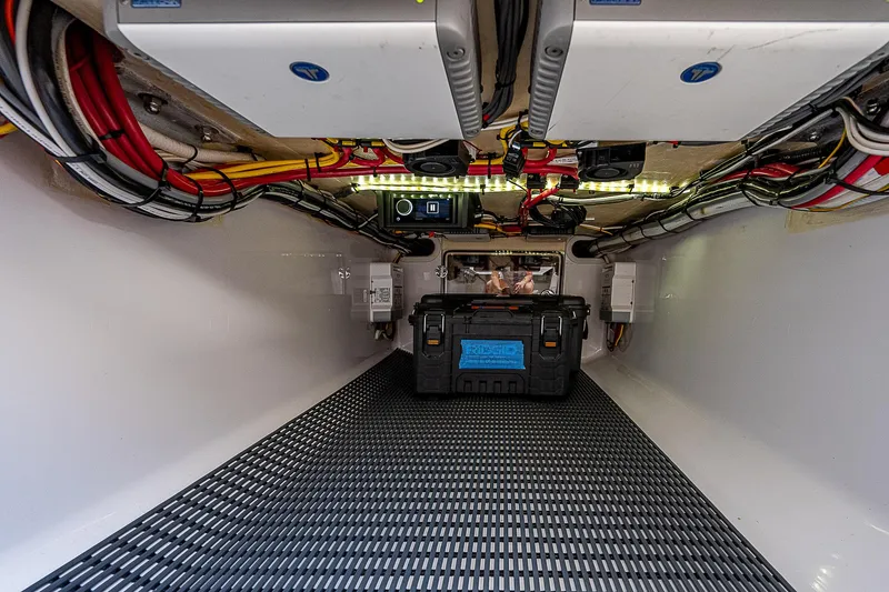 Slide: The Image of Engine compartment of 2013 Bahama Quad V10's with wiring and equipment. - 23