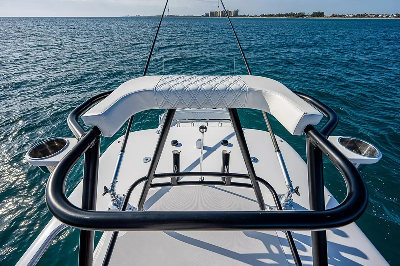 Slide: The Image of 2013 Bahama Quad V10's boat with sleek design on open water. - 28